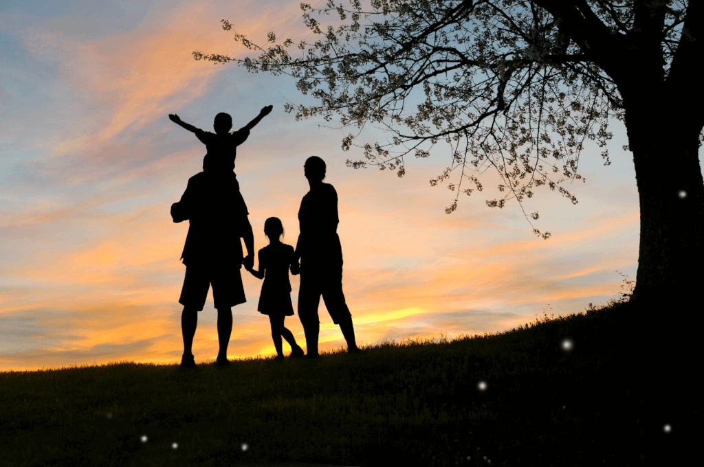 A picture of a family at sunset.
